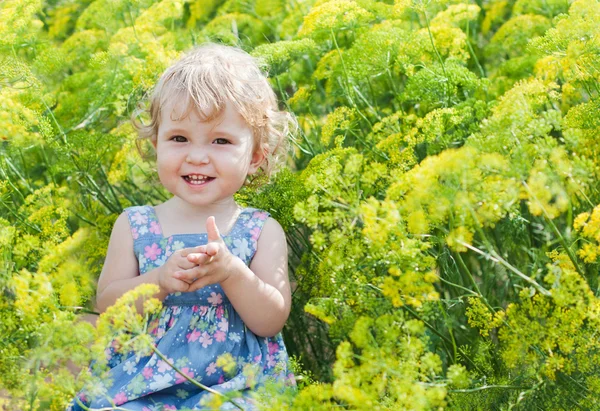 Cute little girl on the background color of dill — Stock Photo, Image