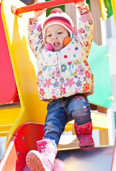 Little girl playing outdoors — Stock Photo, Image