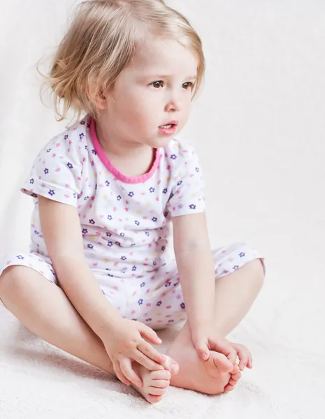 Adorable little girl in pajamas — Stock Photo, Image