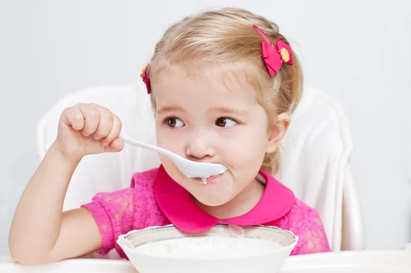 Cute little girl eats — Stock Image Cute little girl eats Royalty Free Stock Images