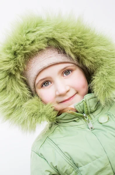 Sonriente niño en capucha de piel —  Fotos de Stock