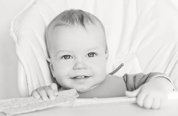 Happy baby boy eating — Stock Photo, Image