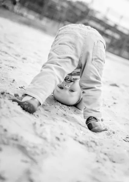 happy baby toddler standing upside down