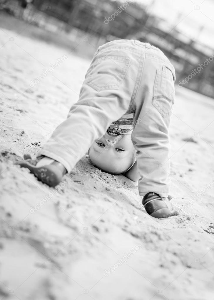 happy baby toddler standing upside down 