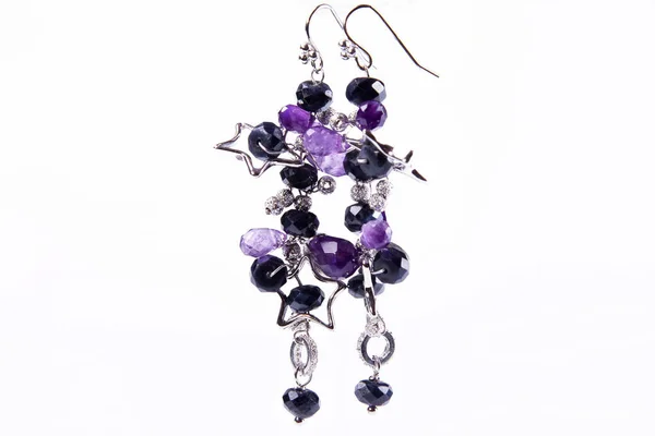 Womens jewelry: earrings with multi-colored stones., close-up shooting. — Stock Photo, Image