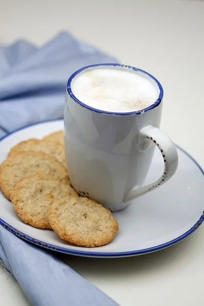 Cup of milk coffee and cookies — Stock Photo, Image