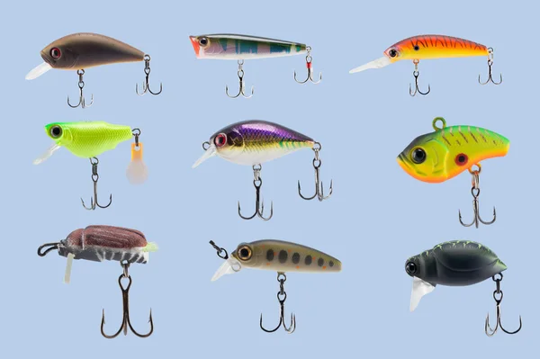 A collage of fishing lures on a blue uniform background — Stock Photo, Image