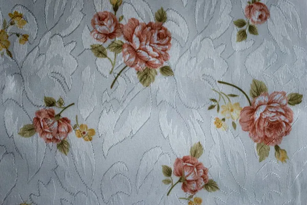 Polyester white tablecloth with beige brown roses — Stock Photo, Image