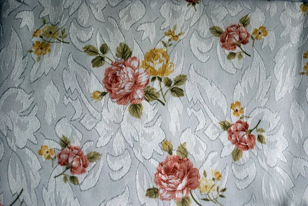 Polyester white tablecloth with beige brown roses — Stock Photo, Image