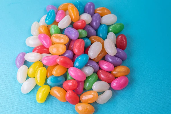 Various Jelly Beans Blue Background — Stock Photo, Image