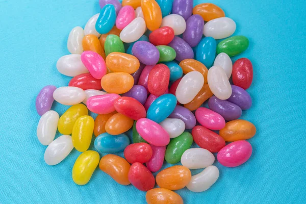 Various Jelly Beans Blue Background — Stock Photo, Image