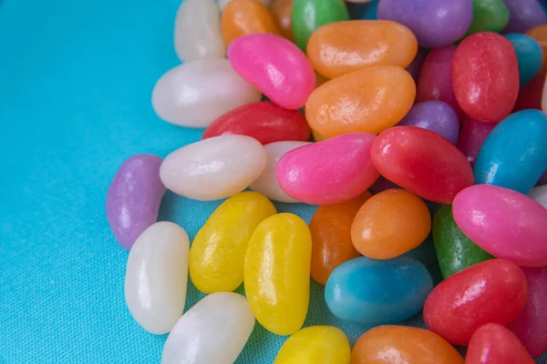 Various Jelly Beans Blue Background — Stock Photo, Image