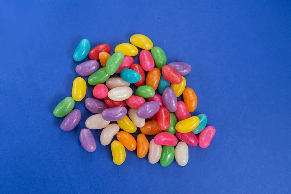 Several Jelly Beans Blue Background — Stock Photo, Image