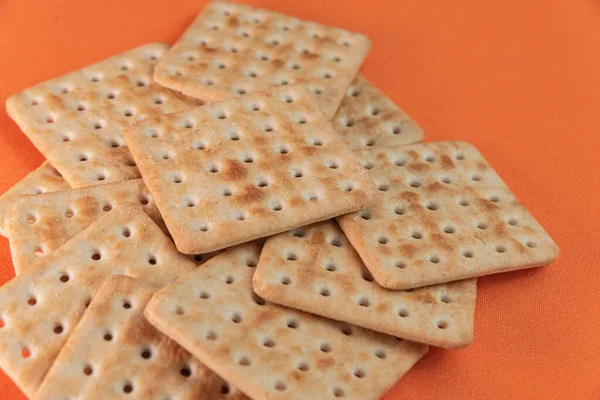 Biscoitos Salgados Fundo Laranja — Fotografia de Stock