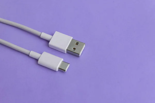 USB cable type C over blue background