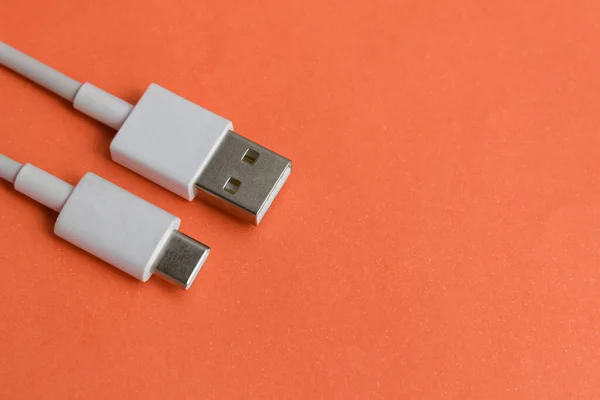 USB cable type C over red background