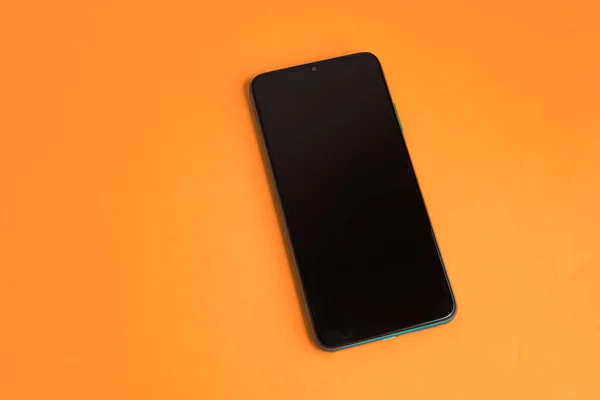 Nieuwe Mobiele Telefoon Kleurrijke Achtergrond — Stockfoto