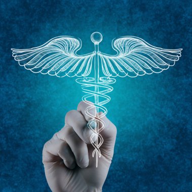 el caduceus beyaz tahtaya çizer.