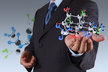 bir molekül tutan işadamı