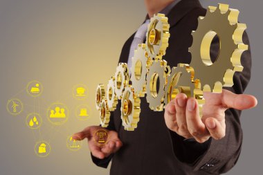 businessman hand show golden gear to success as industry concept clipart