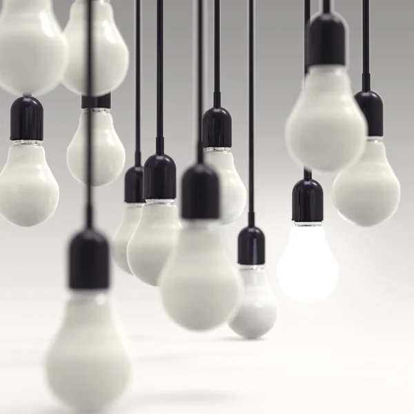 Creative idea and leadership concept light bulb on grey — Stock Photo, Image