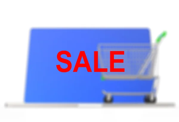 Ein Warenkorb sitzt auf einem Laptop, um das Online-Shopping darzustellen — Stockfoto