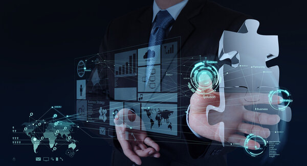 business man hand working with computer interface show puzzles
