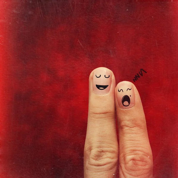 A happy couple in love with painted smiley — Stock Photo, Image