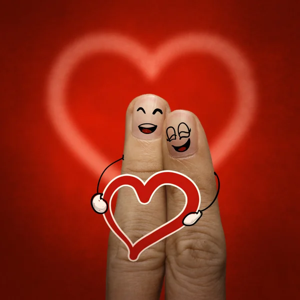 Het paar gelukkig vinger in liefde met geschilderde smiley — Stockfoto