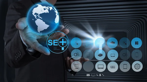 Businessman hand showing search engine optimization SEO — Stock Photo, Image