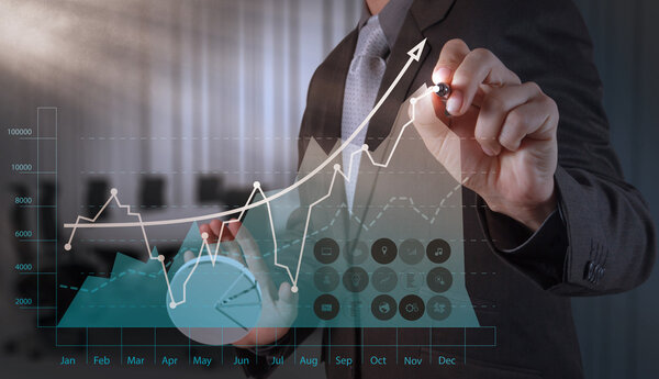 business man hand working with new modern computer and business s
