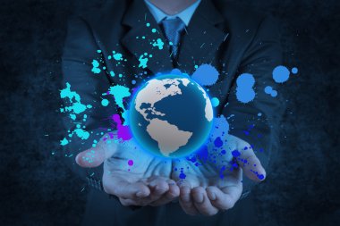 businessman holding a glowing earth globe in his hands and splas clipart