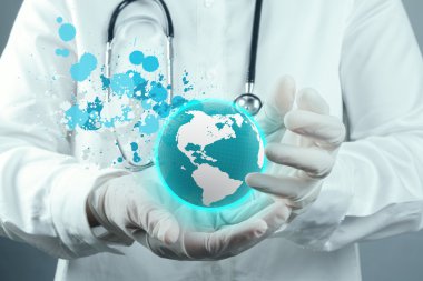 Doktor onun elinde tutan dünya Küre ve splash renkleri