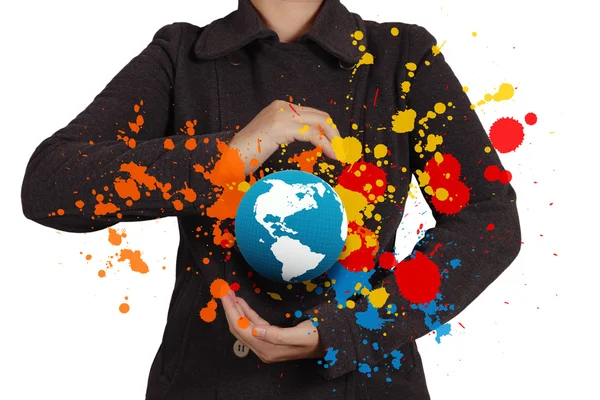 Businesswoman shows the earth and splash colors — Stock Photo, Image