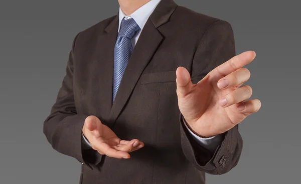 Businessman pressing an imaginary button on virtual screen — Stock Photo, Image