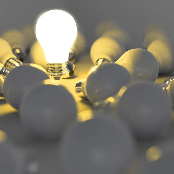 Lâmpada crescente que se destaca da lâmpada incandescente não iluminada — Fotografia de Stock