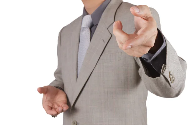 Businessman pressing an imaginary button on virtual screen Royalty Free Stock Images