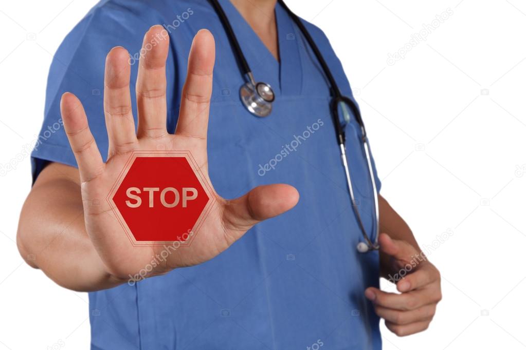 medical doctor hand surgeon shows stop sign with his hand