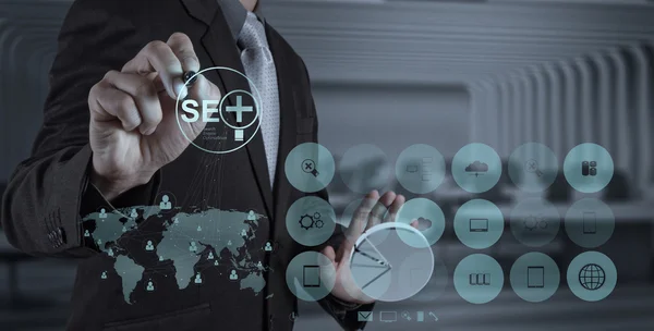 Businessman hand showing search engine optimization SEO — Stock Photo, Image