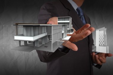 işadamı el ev modeli buruşuk kağıt adam ile gösterir