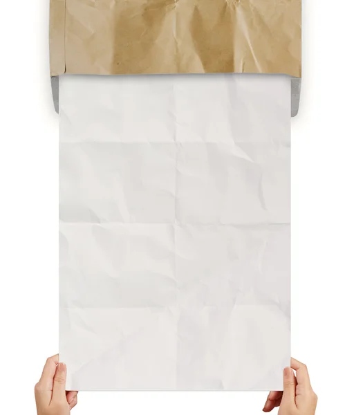 Hand pulling crumpled paper from recycle envelope — Stock Photo, Image