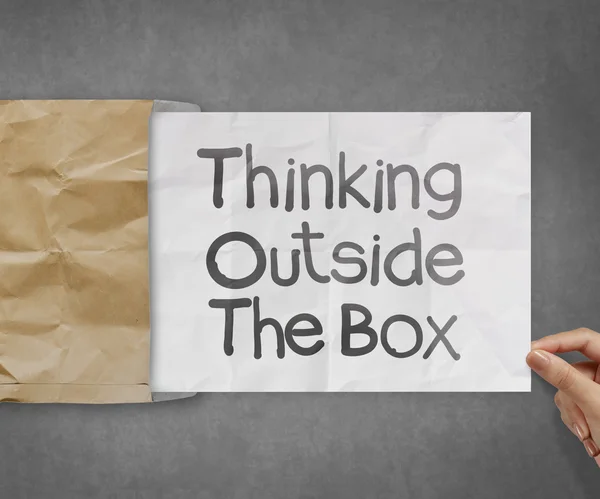 Thinking outside te box on crumpled paper — Stock Photo, Image