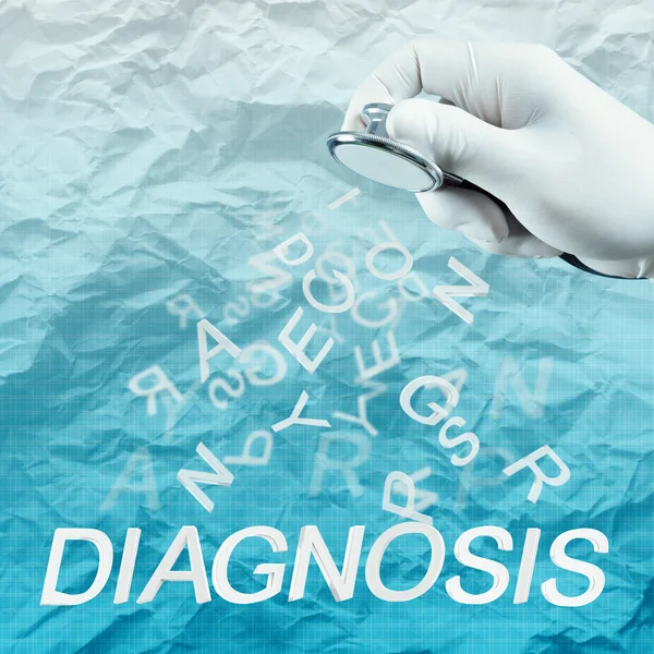Stetoskop i hand med diagnos ord som medicinska begrepp — Stockfoto