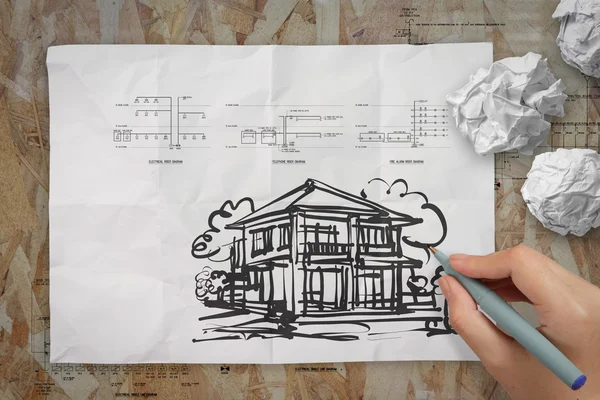 Hand drawing house on wrinkled paper — Stock Photo, Image