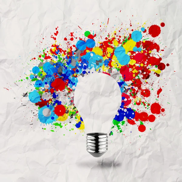 Invisible light bulb and splash colors on crumpled paper — Stock Photo, Image