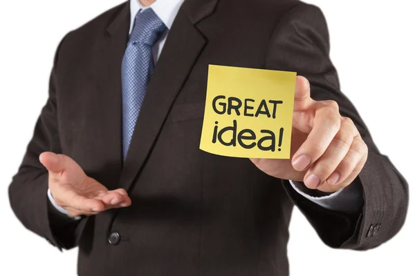 Businessman hand show great idea words on sticky note with white — Zdjęcie stockowe