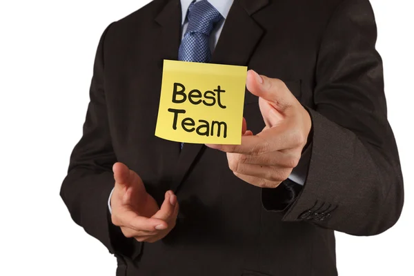Businessman hand show best team words on sticky note with white — Stock Photo, Image