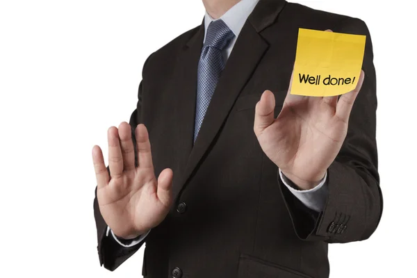 Business man hand show well done words on sticky note with white — стоковое фото