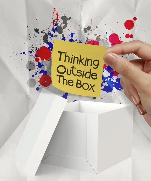 Thinking outside the box and splash colors crumpled paper as con — Stock Photo, Image