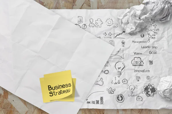 Business concept on crumpled paper and sticky note background — Stock Photo, Image